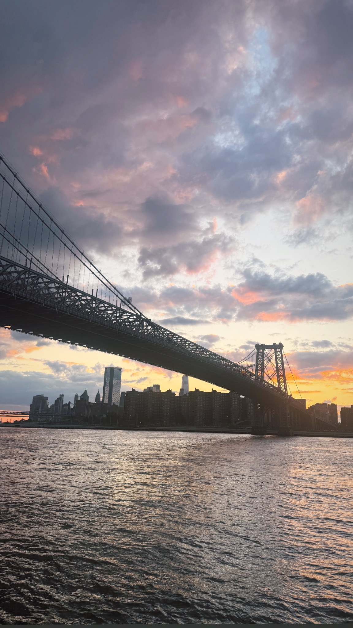 NYC skyline and bridge at sunset